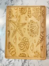 Load image into Gallery viewer, Sea Shell Design Maple or Walnut Cutting Board
