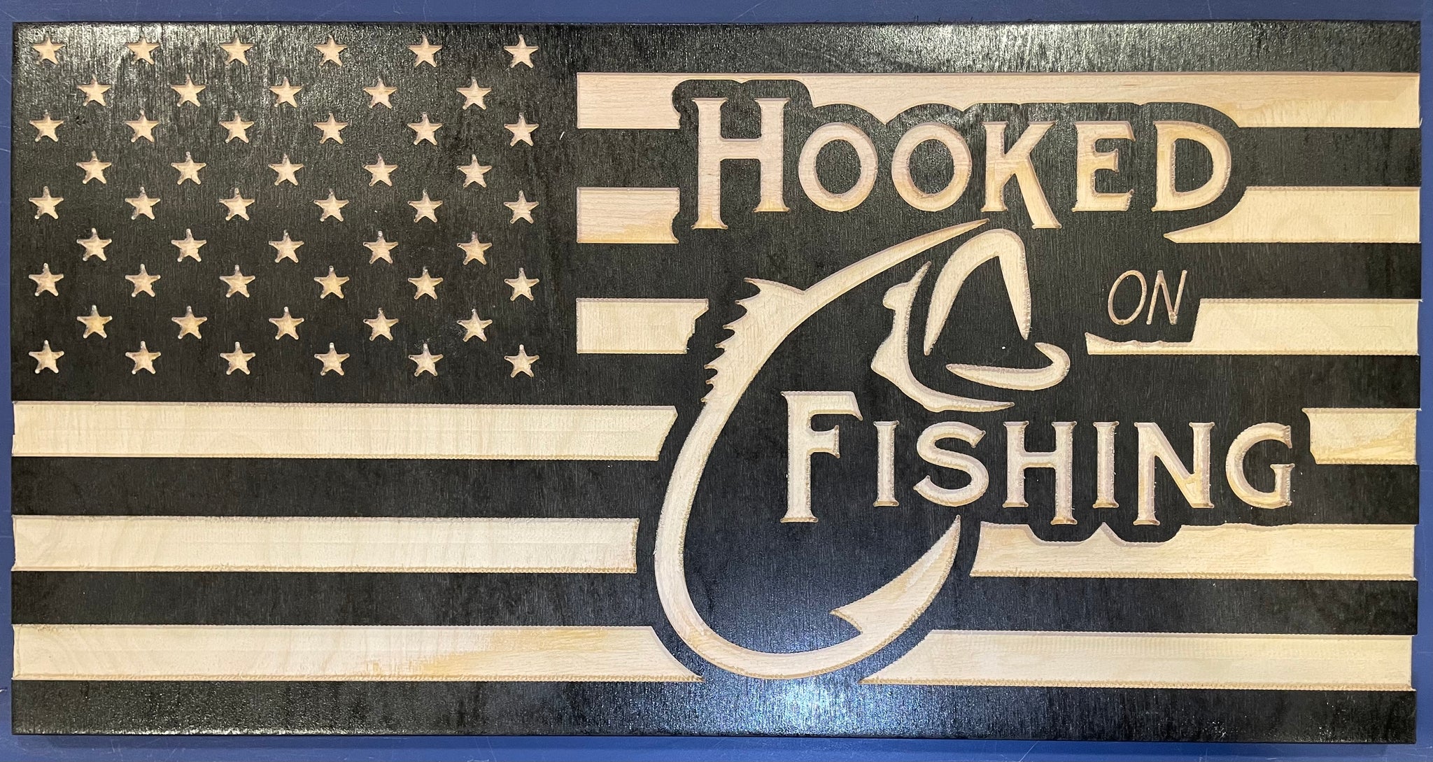 Carved “Hooked on Fishing” flag